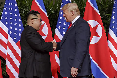 TrumpU.S. President Donald Trump shakes hands with North Korea leader Kim Jong Un at the Capella resort on Sentosa Island Tuesday, June 12, 2018 in Singapore. | AP