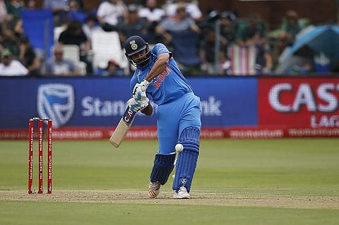 Rohit Sharma hits a four on a ball delivered by South Africa bowler Kagiso Rabada during the fifth One Day International cricket. | AFP File Photo