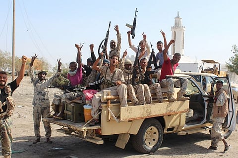 Forces loyal to the Saudi-backed Yemeni president flash their arms (File | AFP)