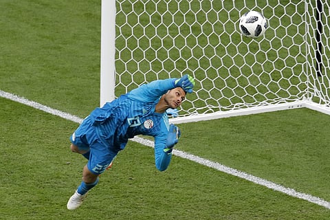 Egypt goalkeeper Mohamed Elshenawy clears the ball during the group A match between Egypt and Uruguay at the 2018 soccer World Cup in the Yekaterinburg Arena in Yekaterinburg, Russia, Friday, June 15, 2018. | AP