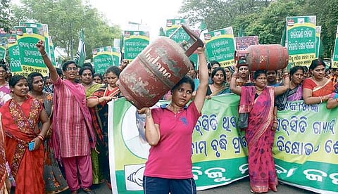 Activists of Biju Mahila janata Dal taking out a rally against hike in LGP price in bhubaneswar on Friday | Express