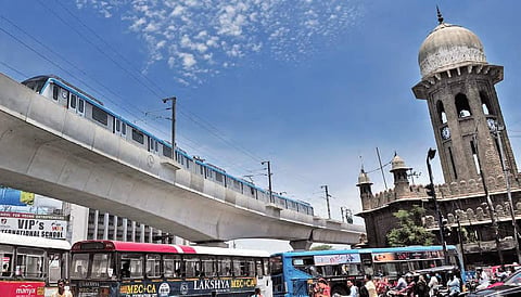 Metro rail passing through Moazzam Jahi market during a trial run between Ameerpet and LB Nagar on Wednesday |Express