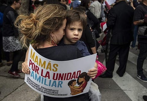 People take part in a protest against US immigration policies outside the US embassy in Mexico City on June 21, 2018. | AFP