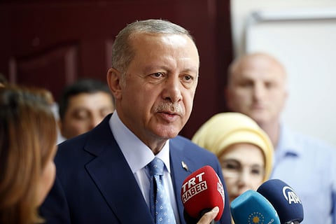 Turkey's President and ruling Justice and Development Party, or AKP, leader Recep Tayyip Erdogan talks to journalists at a polling station for Turkey's elections in Istanbul, Sunday, June 24, 2018. | Associated Press