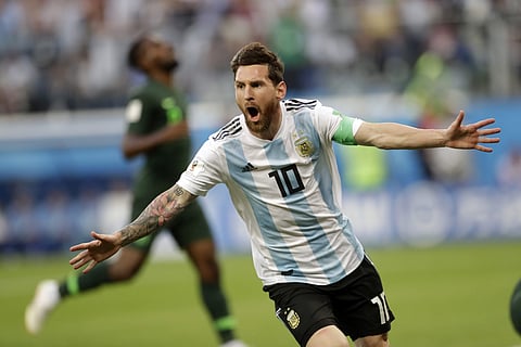 Argentina's Lionel Messi celebrates after scoring the opening goal of his team during the group D match between Argentina and Nigeria, at the 2018 soccer World Cup in the St. Petersburg Stadium.
