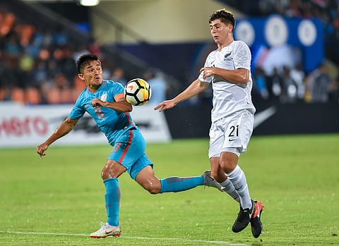 Indian player Sunil Chhetri and New Zealand player Liberato Gianpaolo Cacace compete for the ball during the Hero Intercontinental football Cup. | PTI