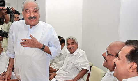 Opposition leader Ramesh Chennithala, Muslim League national general secretary PK Kunhalikutty and former Chief Minister Oommen Chandy are all smiles as Kerala Congress leader K M Mani speaks at the UDF meeting on Friday | B P Deepu