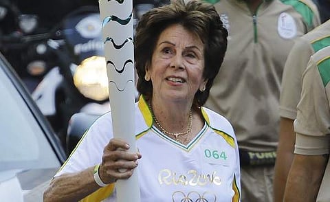 former No. 1-ranked tennis player Maria Esther Bueno carries the Rio 2016 Olympic torch during the torch relay in Sao Paulo, Brazil. (File | AP)