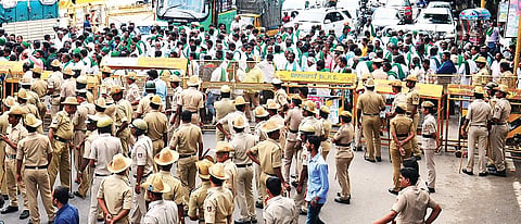 Farmers stage a protest at Sheshadri Road in Bengaluru on Monday | pushkar v