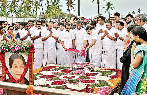 Chief Minister Edappadi K Palaniswami pays respects to former CM J Jayalalithaa after completion of the Assembly session on Monday. Deputy CM O Pannerselvam and other leaders look on | Express