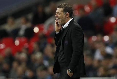 West Ham's manager Slaven Bilic watches from the sidelines during the English League Cup soccer match between Tottenham Hotspur and West Ham at Wembley stadium in London. | AP