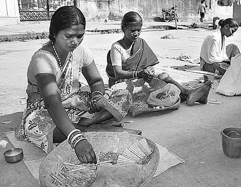 Women rolling beedis at a factory in Sambalpur district. (File | ENS)