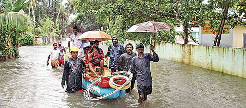 Fire and Rescue Services personnel shifting people who got stranded near Kanjiram temple, in Kottayam on Thursday | Vishnu Prathap