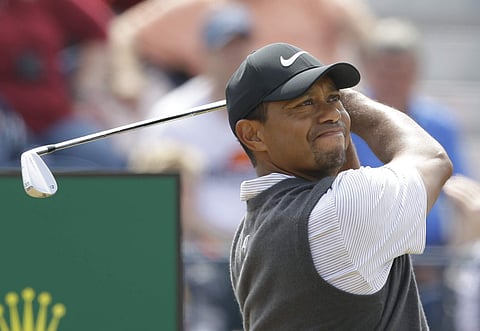 Tiger Woods of the US plays off the 3rd tee during the third round of the British Open Golf Championship in Carnoustie. | AP