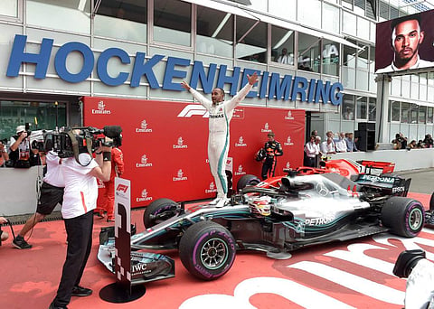 Mercedes driver Lewis Hamilton of Britain celebrates after winning the German Formula One Grand Prix at the Hockenheimring racetrack in Hockenheim, Germany. (Photo | AP)