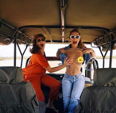 Rita Ora goes topless