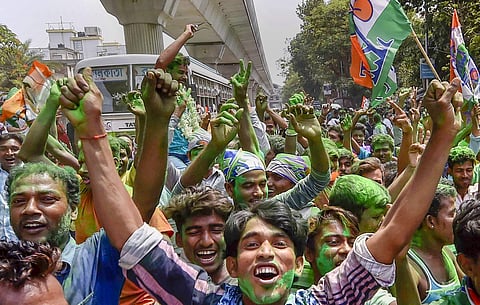 All India Trinamool Congress supporters celebrate during Panchayat poll election results outside the counting station in North 24 Parganas, 17 May 2018. | PTI