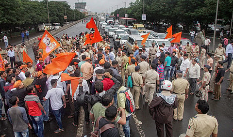 Maratha Kranti Morcha activists stop the traffic during their statewide bandh called for reservations in jobs and education in Thane Mumbai on Wednesday July 25 2018. | PTI