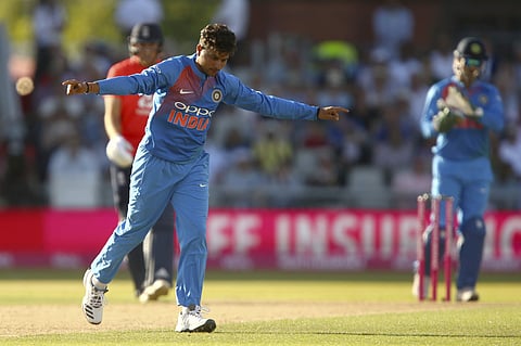 India's Kuldeep Yadav celebrates taking the wicket of England's Jos Buttler during the first T20 match between England and India at Old Trafford cricket ground in Manchester, England, Tuesday, July 3, 2018. | AP