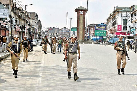 A file image of police personnel stand guard in Srinagarduring a shutdown called by separatists. (File| PTI)