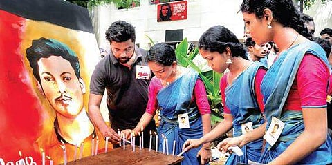 Students pay tribute to Abhimanyu by lighting candles on the Maharaja’s College premises. | (A Sanesh | EPS)