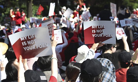 Woman protesters stage a rally to demand stronger government action to fight the spread of intimate photos and footage taken by hidden cameras, which they say have women living in constant anxiety and distress, in Seoul, South Korea. (Photo | AP)