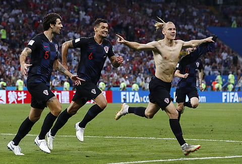 Croatia's Domagoj Vida, right, celebrates with his teammates after scoring his side's second goal during the quarterfinal match between Russia and Croatia at the 2018 FIFA World Cup. (File photo | AP)