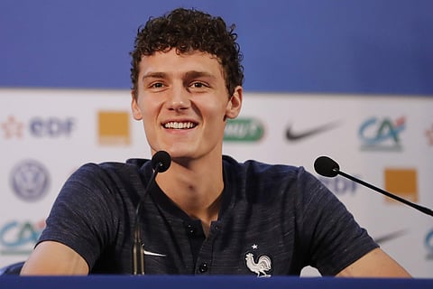 France's Benjamin Pavard smiles as he answers journalists during a press conference at the 2018 soccer World Cup in Istra, Russia, Sunday, July 8, 2018. | AP
