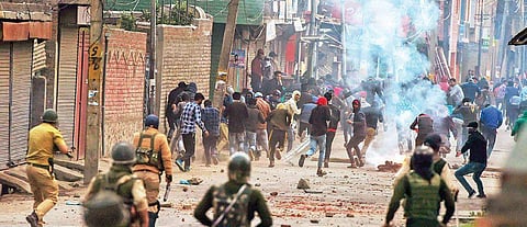 Police and CRPF personnel chase stone pelters during a protest in Srinagar (File Photo | PTI)