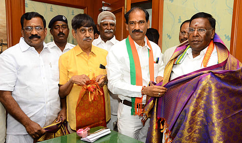 Three nominated BJP MLA's V.saminathan, K.G. Shankar and Selvaganapathy of Puducherry greeting Chief minister V.Narayanasamy at Puducherry legislative assembly. (Photo | Pattabi Raman/ EPS)