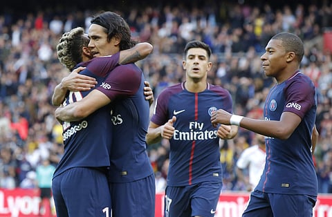 PSG's Neymar, left, congratulates Edison Cavani , center, for his second gaol as Lucas Mbappe looks on during a French League One soccer match Paris-Saint-Germain against Bordeaux at Parc des Princes stadium in Paris. | (File | AP)