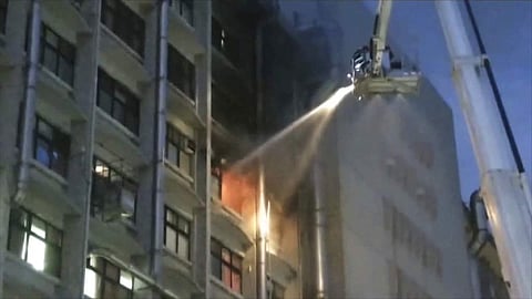 In this image from a video, firefighters try to extinguish fire at Taipei Hospital of the Ministry of Health and Welfare in New Taipei City, Taiwan Monday, Aug. 13, 2018. (Photo | AP)