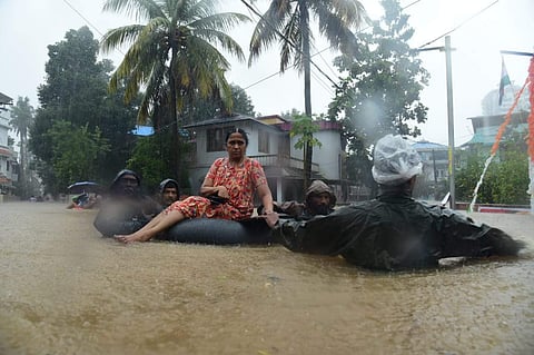A woman being rescued as the flood situation in Kerala worsened on Wednesday (Photo | Albin Mathew/EPS)