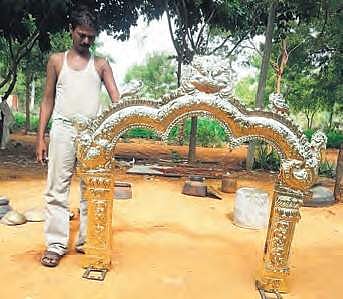 K Ramaiah from Onipenta making a brass pail; G Ramesh, an Onipenta artisan, showing his work — an arch for a temple entrance | Express