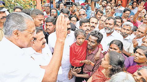 Chief Minister Pinarayi Vijayan with the inmates of a relief camp at Chengamanad school in Kochi. (Photo | Melton Antony/EPS)