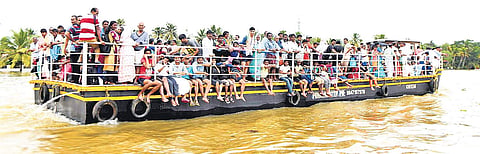 Rescued people being shifted to upper lands from Kuttanad on a jhankar arranged by the district administration on Friday | EXPRESS