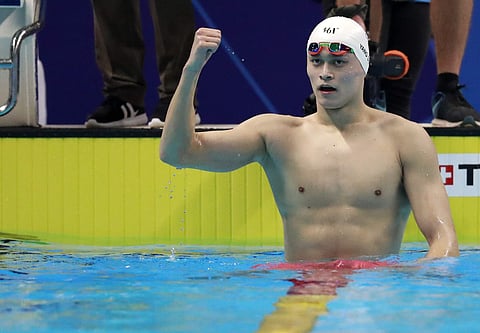 China's Sun Yang celebrates after winning the men's 800m freestyle final during the swimming competition at the 18th Asian Games in Jakarta, Indonesia, Monday, Aug. 20, 2018. | AP