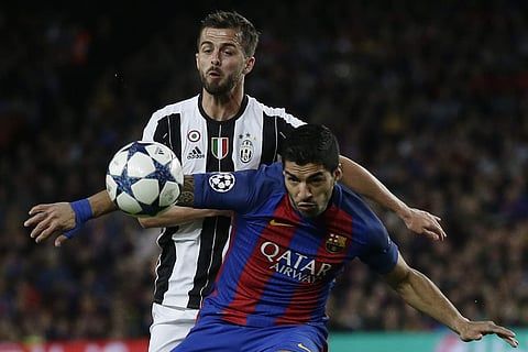 Barcelona's Luis Suarez, right, challenges Juventus's Miralem Pjanic, left in a Champions League match.| (File | AP)