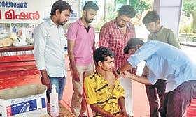 A doctor administering tetanus vaccination to a volunteer