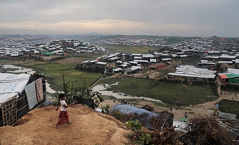 A Rohingya Muslim child who crossed over from Myanmar into Bangladesh, plays in front of her makeshift tent at Jamtoli refugee camp in Ukhiya, Bangladesh. (File Photo | AP)