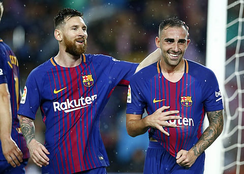 FC Barcelona's Paco Alcacer, right, with Lionel Messi (Photo | File/AP)