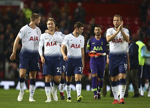 Tottenham's Christian Eriksen, second left, and Harry Kane, right, celebrate after the English Premier League soccer match against Manchester United. | AP