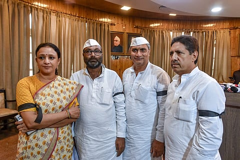 Congress Legislative Party leader Ajay Kumar Lallu with party members with black bands tied on their arms addresses the media at Central Hall of Uttar Pradesh Assembly over the alleged unparliamentary remarks of UP CM Yogi Adityanath in Lucknow on August