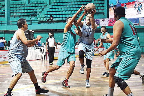 Former India captain Unwin J Antony in action during the veterans basketball match held at the Regional Sports Centre, Kadavanthra, as part of Team Rebound reunion on Saturday | EXPRESS