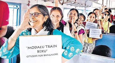 Citizens hop on the suburban train demanding an efficient public transport system in Bengaluru, on Friday | Pushkar V