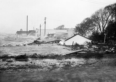 In this October 15, 1954 file photo, High tides, whipped in by Hurricane Hazel, shatter boats and buildings in Swansboro, N.C., as the storm lashes the Atlantic seaboard. (Photo | AP)