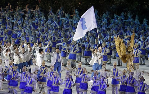 The combined Koreas march into Gelora Bung Karno Stadium under the 'unification' flag during the opening ceremony for the 18th Asian Games in Jakarta (Photo | AP)