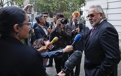 F1 Force India team boss Vijay Mallya speaks to the media outside Westminster Magistrates Court during a break for lunch as he attends a hearing at the court in London, Wednesday, Sept. 12, 2018. | AP