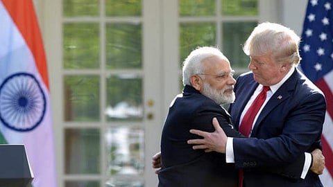 President Donald Trump and Prime Minister Narendra Modi hug in Washington.