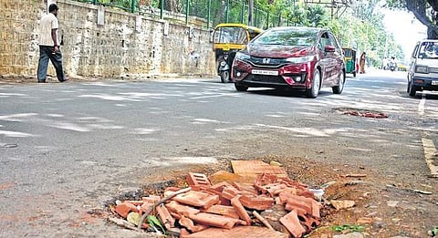 Potholes quick-flixed on a road in Rajajinagar, on Monday.| (Shriram B N | EPS)